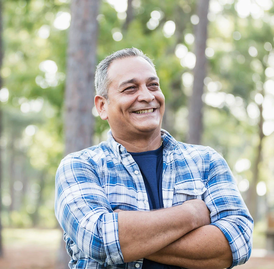 man smiling with arms crossed | Las Vegas Surgical Associates