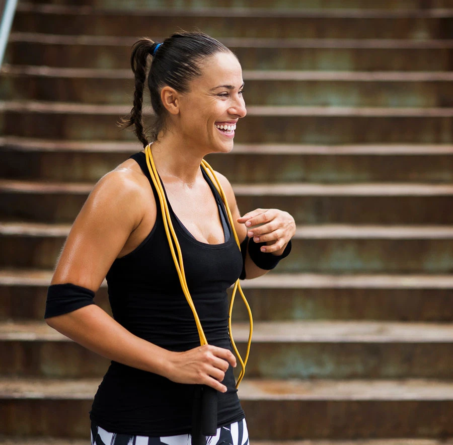 woman in black tank top exercising | Las Vegas Surgical Associates